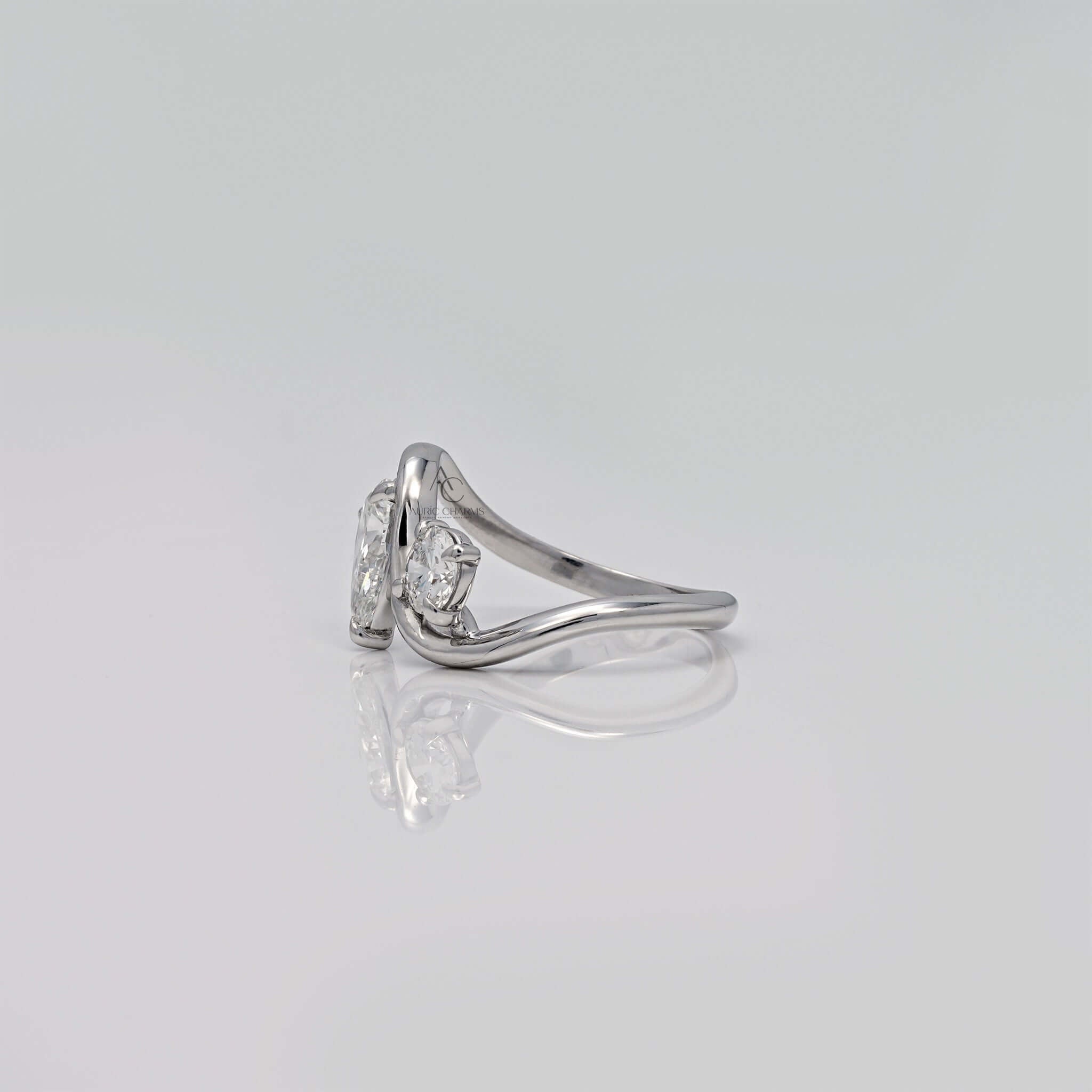 Profile view of diamond bypass ring showing band curvature.