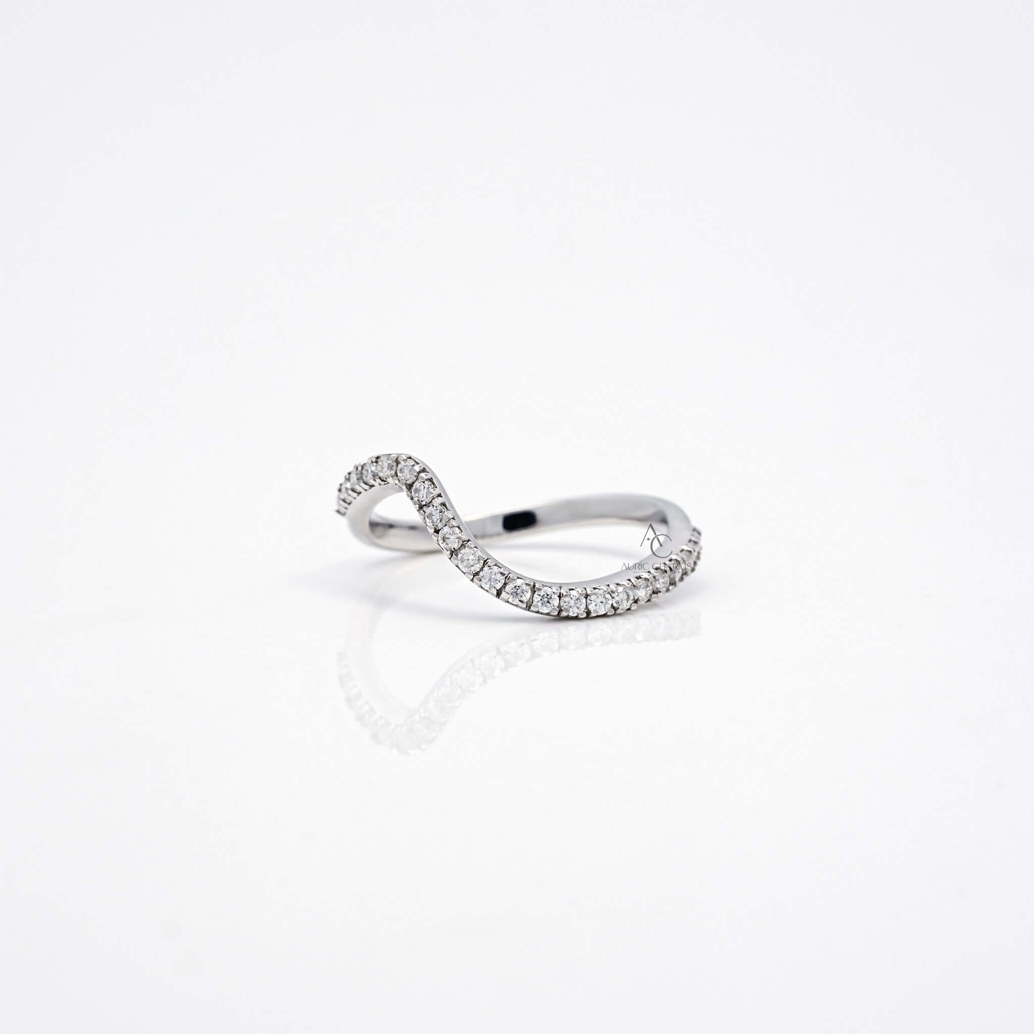 Side view of wavy diamond band showcasing curve and diamond setting.