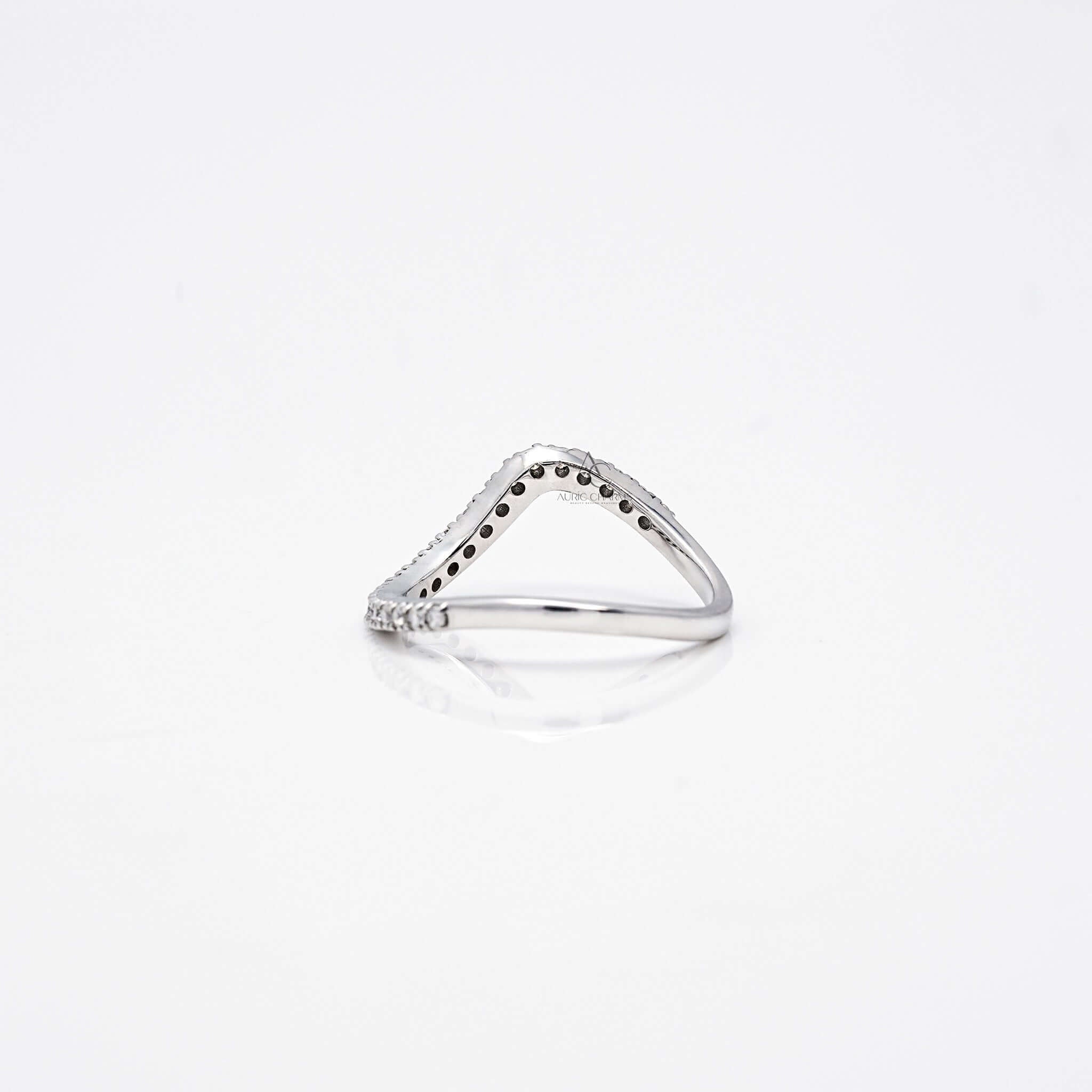 Back view of wavy diamond band highlighting open gallery design.