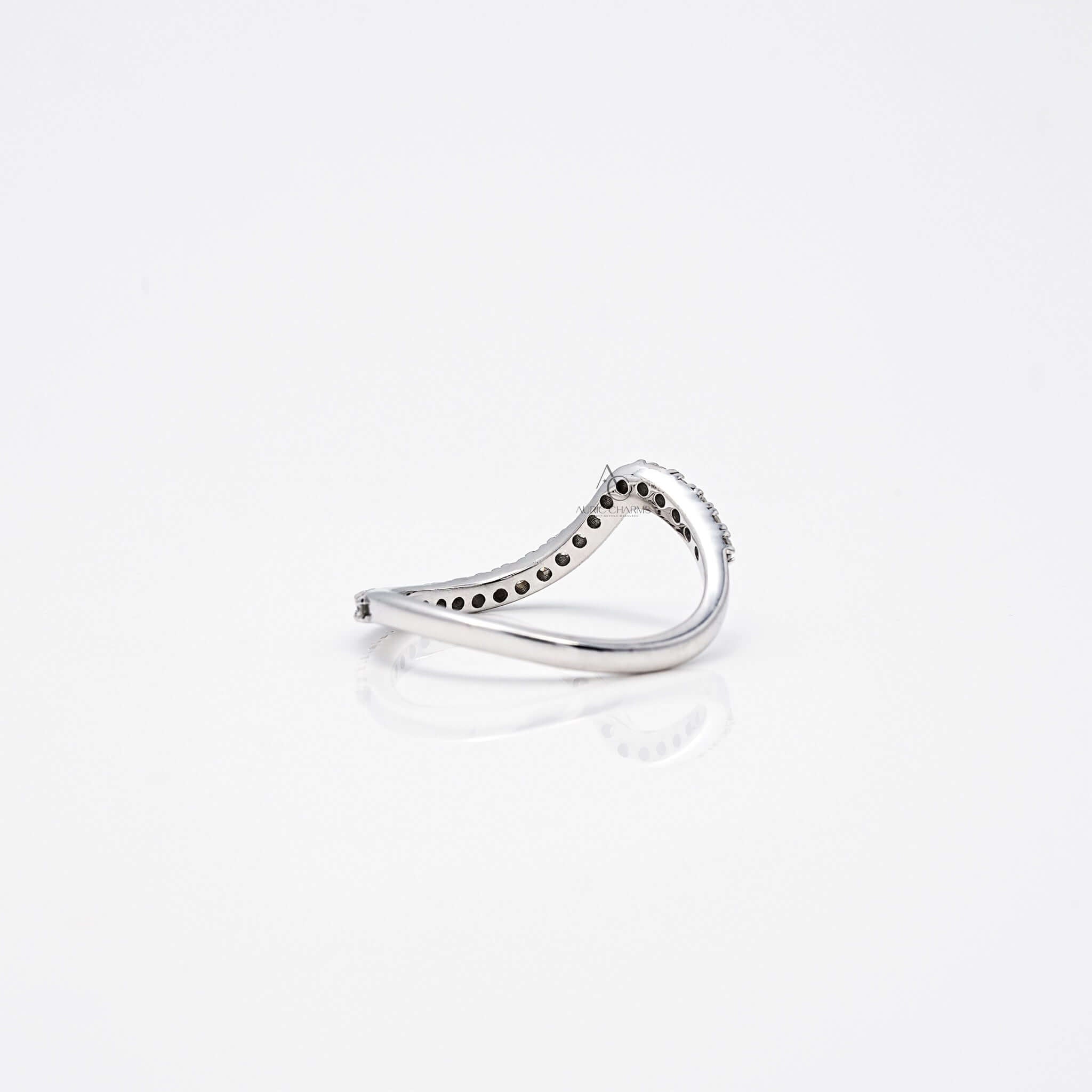 Angled back view of wavy diamond band showing intricate under-gallery.