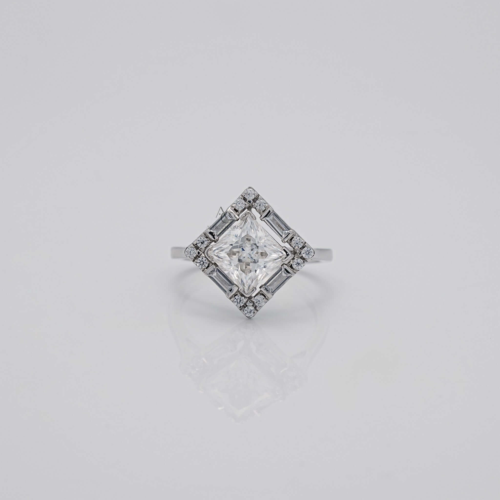 Square-cut diamond ring with a halo of accent stones.