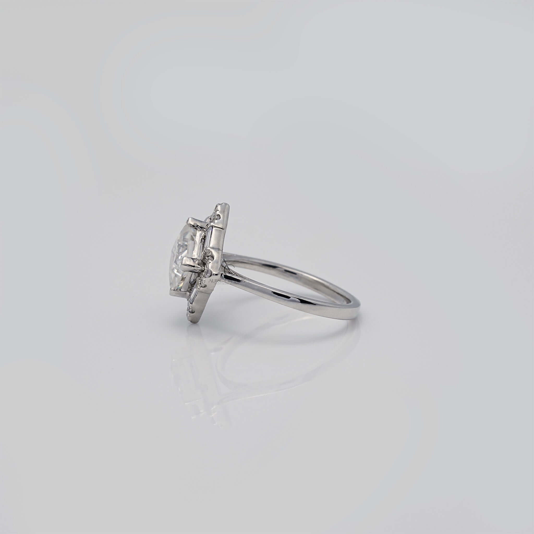 Profile view of square diamond ring in silver setting.