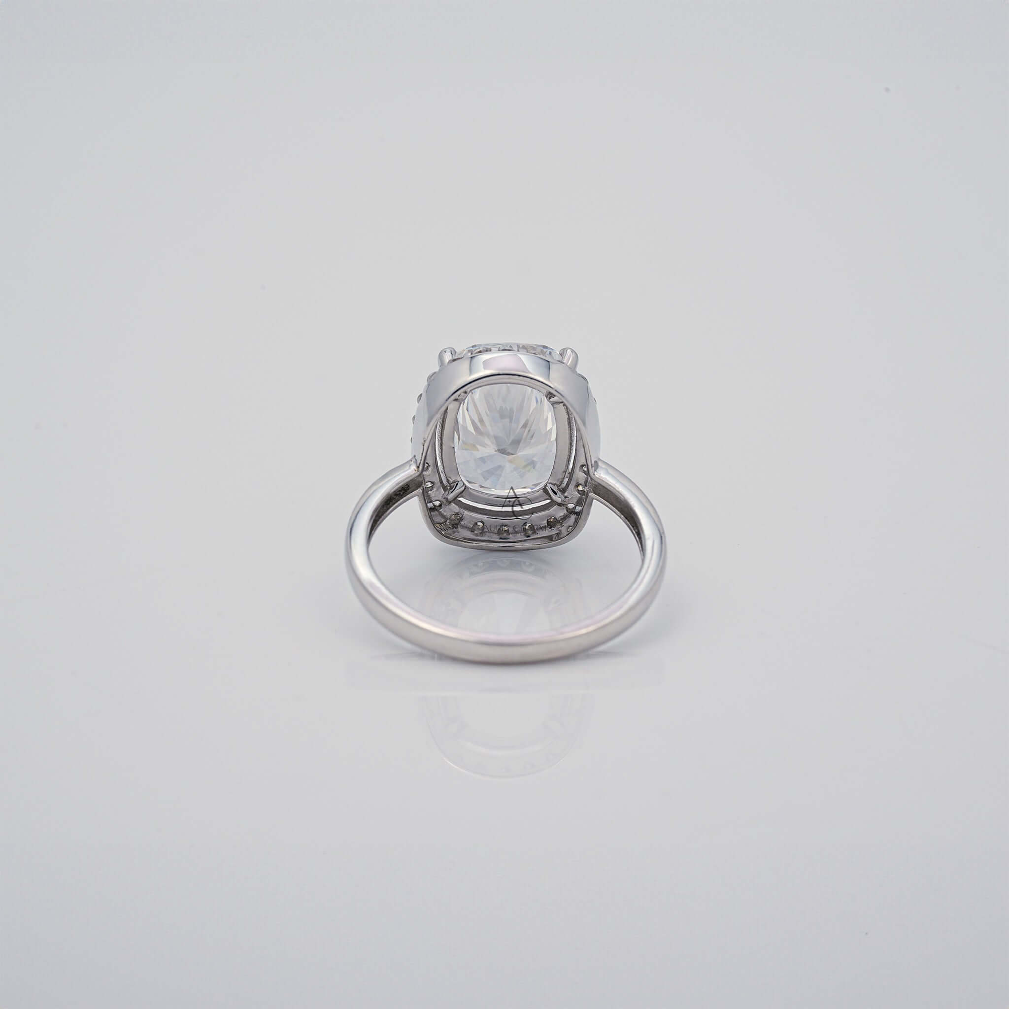 Back view of cushion-cut diamond halo ring with setting detail.