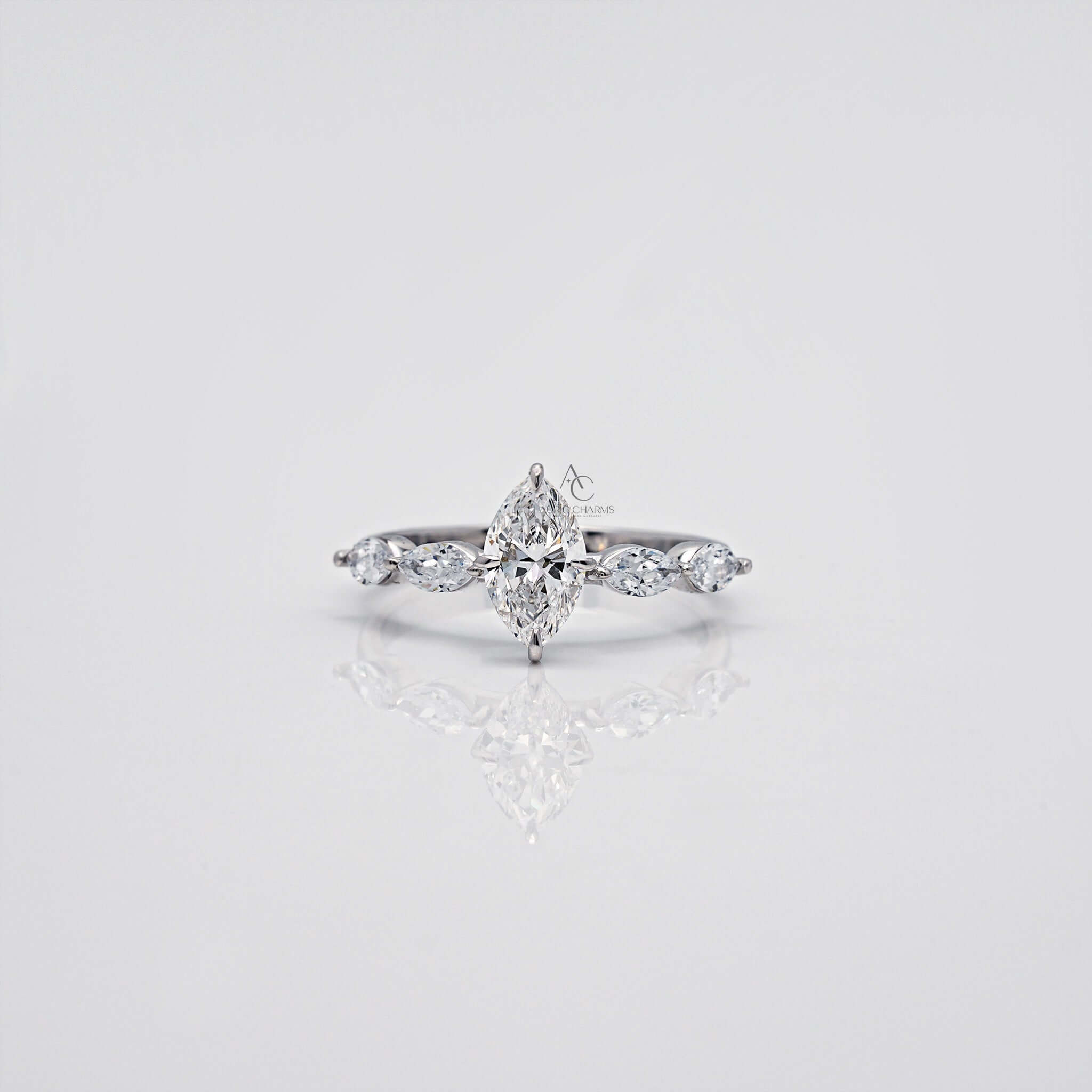Marquise-cut diamond ring with side stones set in white gold.
