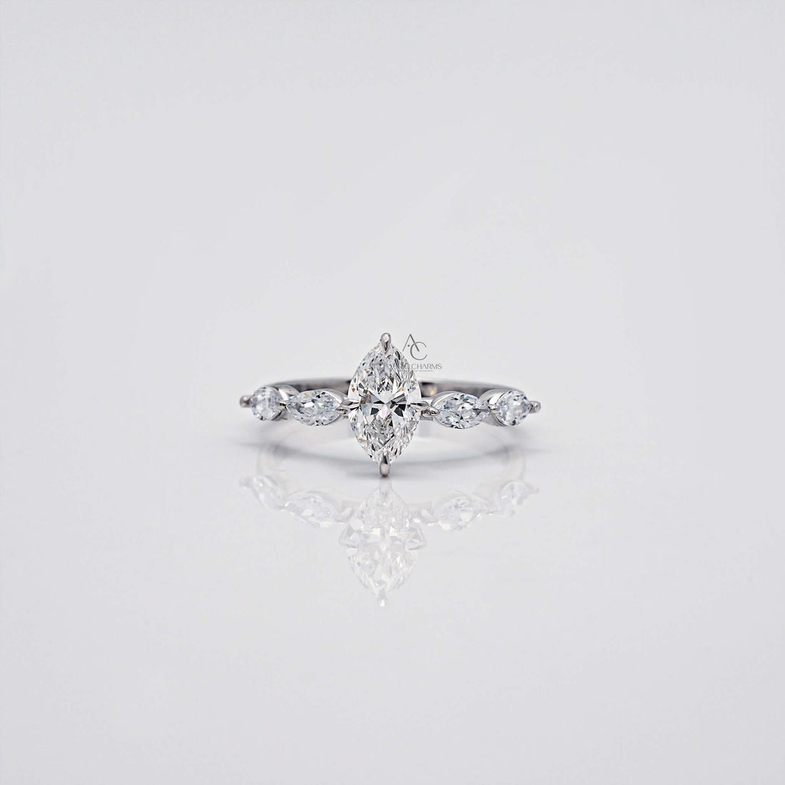 Marquise-cut diamond ring with side stones set in white gold.