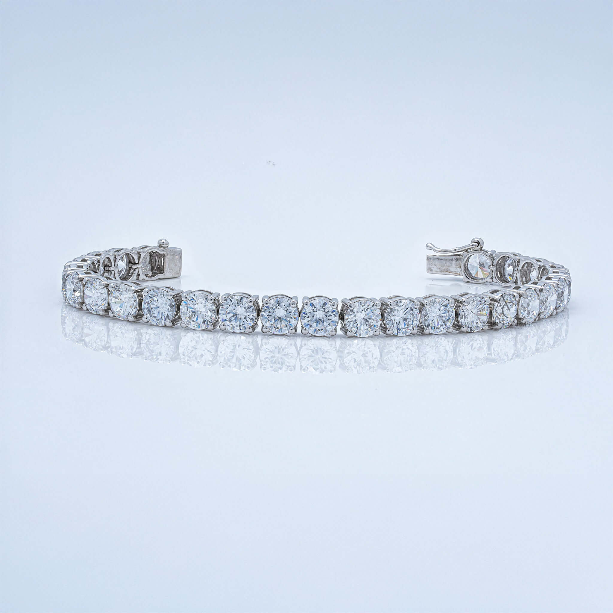 White gold tennis bracelet with round lab-grown diamonds in prong setting.