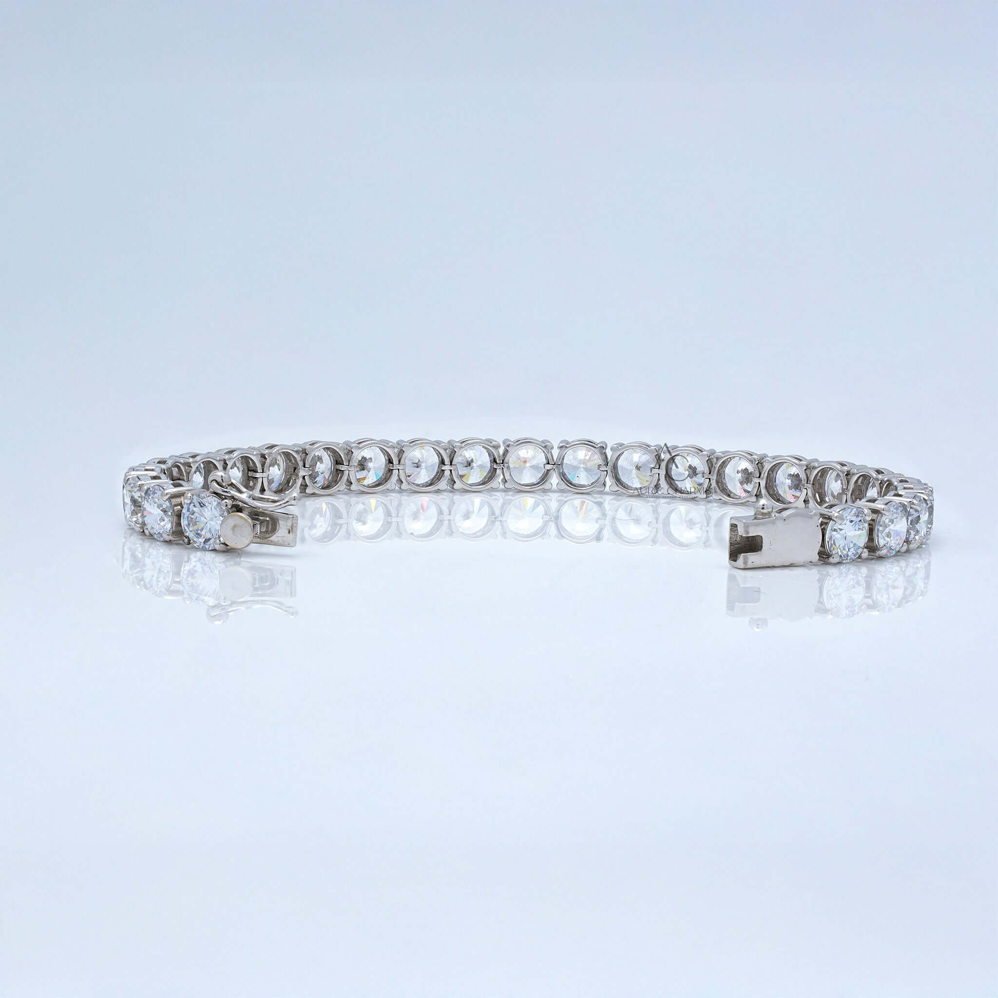 Back view of white gold tennis bracelet with lab-grown round diamonds and secure clasp.