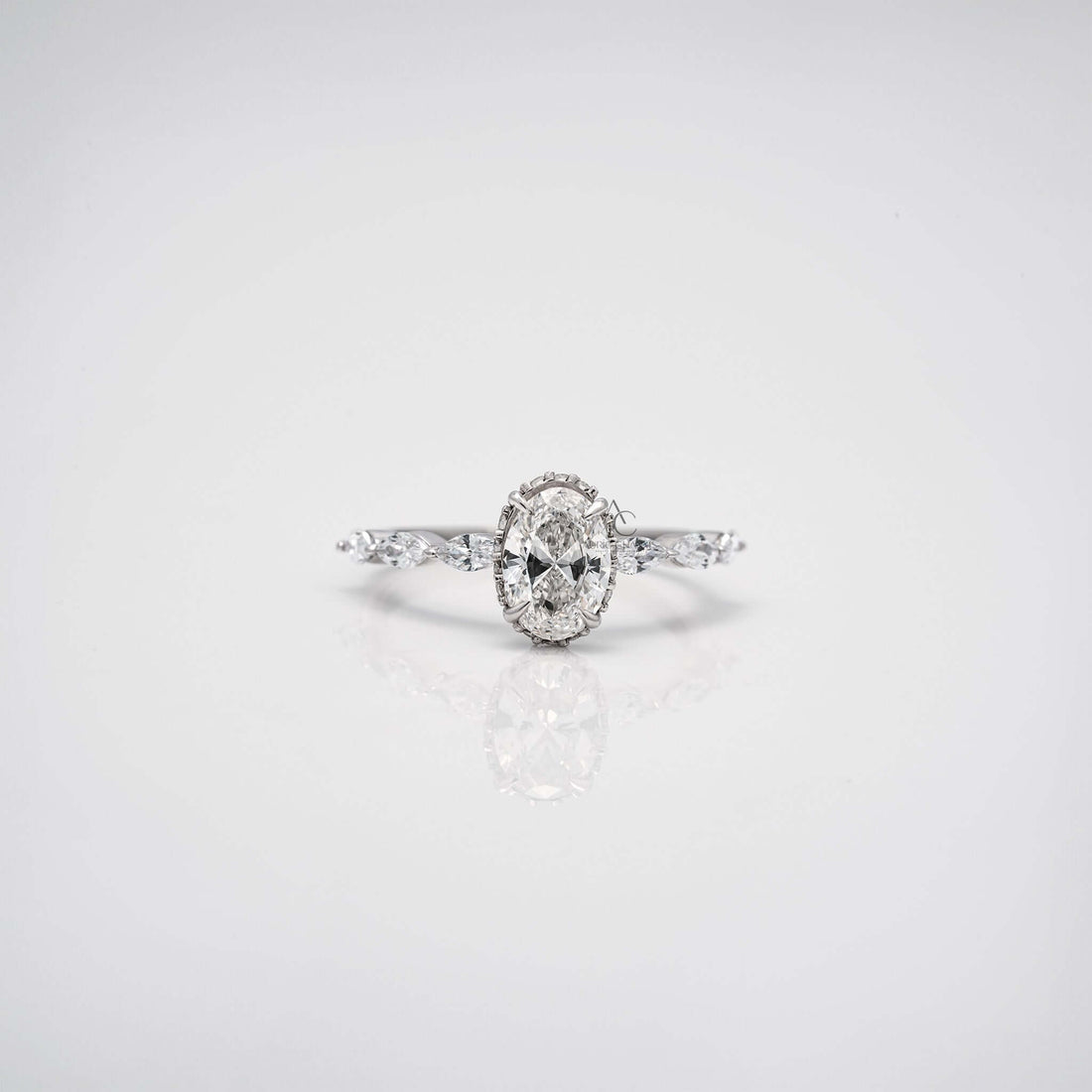 Close-up 360 view of oval diamond engagement ring with marquise side stones.