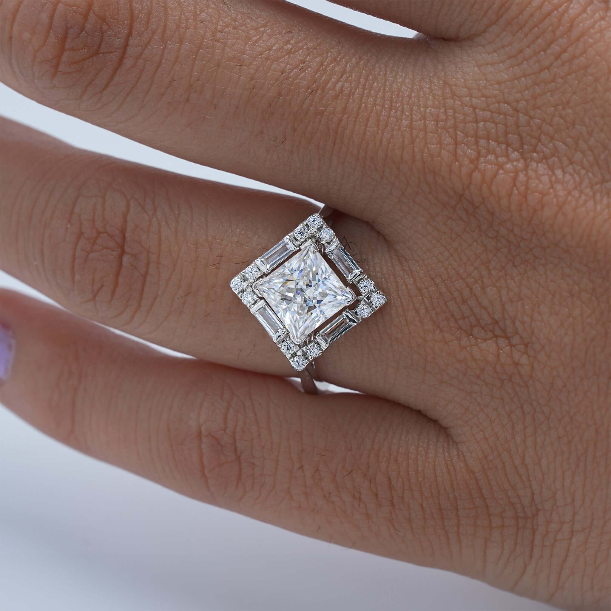 Square diamond halo ring displayed on finger.