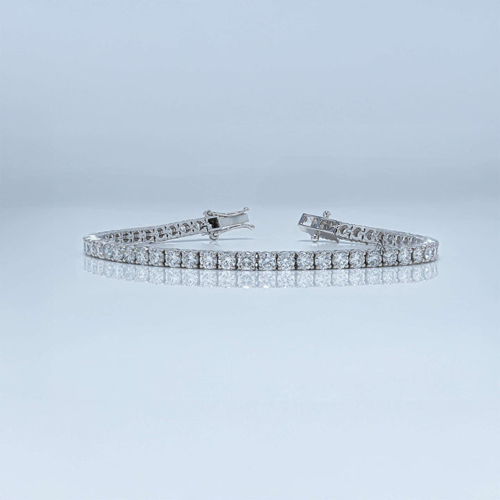 White gold tennis bracelet with round lab-grown diamonds and a secure clasp.