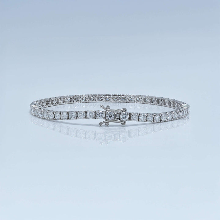 White gold tennis bracelet with round lab-grown diamonds in minimal prong setting.