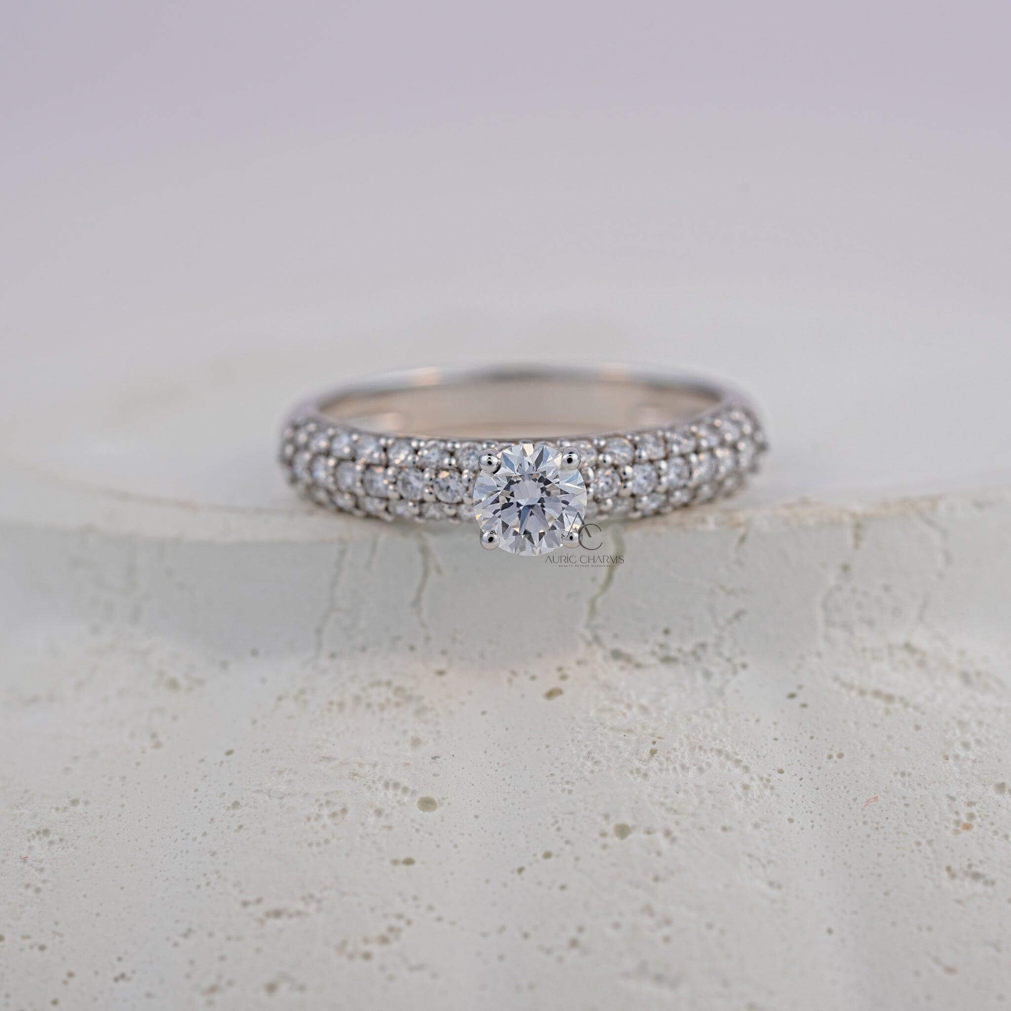 A detailed top-down shot of a round-cut diamond pavé ring, emphasizing its intricate triple-row diamond setting and premium materials.