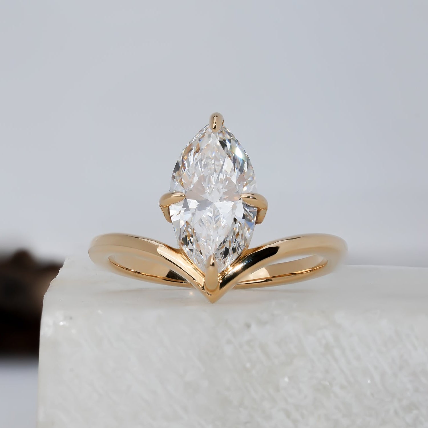 Elegant Lyra marquise solitaire lab-grown diamond ring, featuring sustainable luxury and a graceful golden arc.