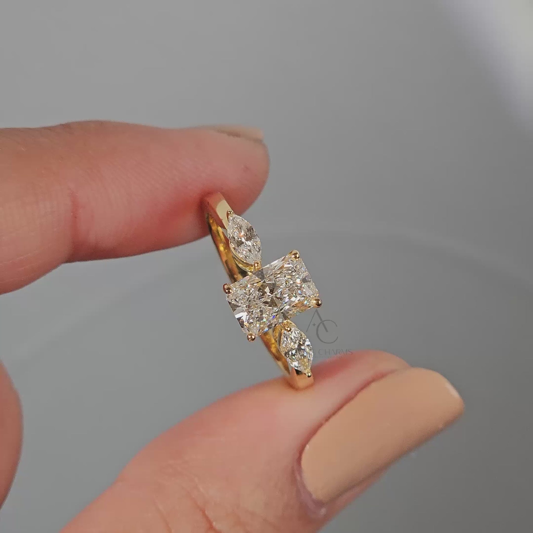 Elegant radiant cut diamond engagement ring video showcasing its brilliance with lab-grown diamonds and marquise side stones in a sustainable platinum design.