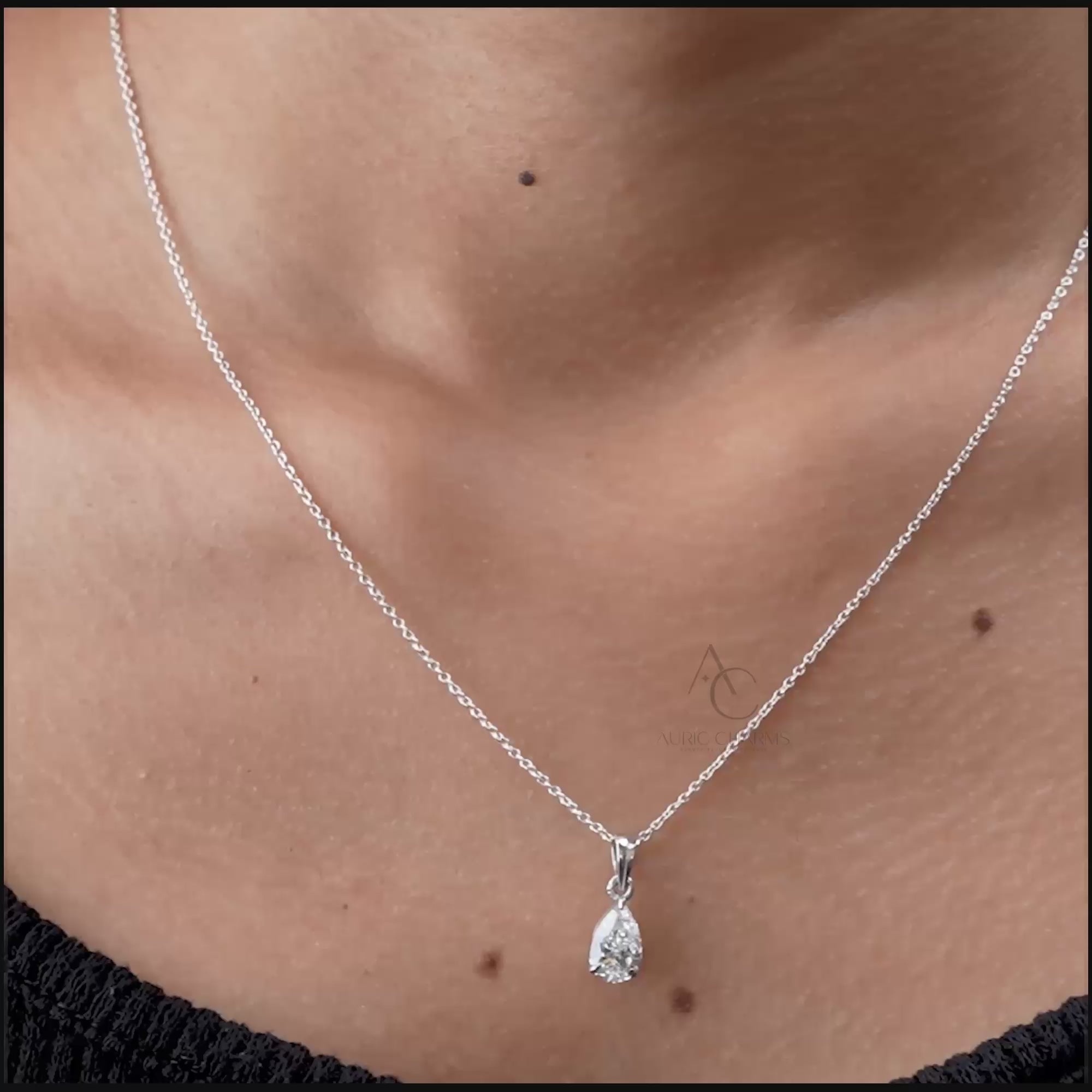 Teardrop lab-grown diamond pendant on a white gold chain, rotating to show sparkle and detail.