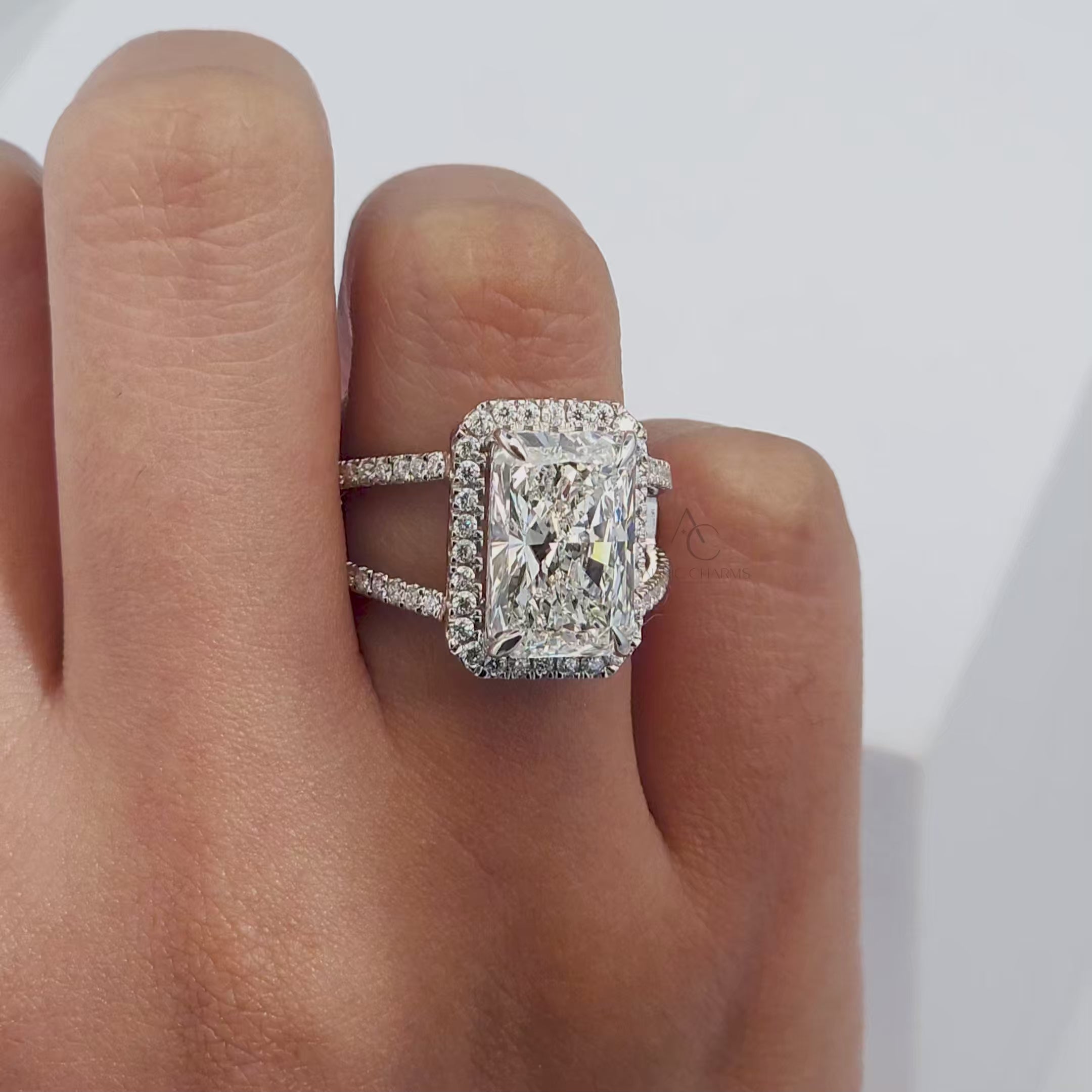 360-degree view of radiant-cut diamond halo ring with split shank design.