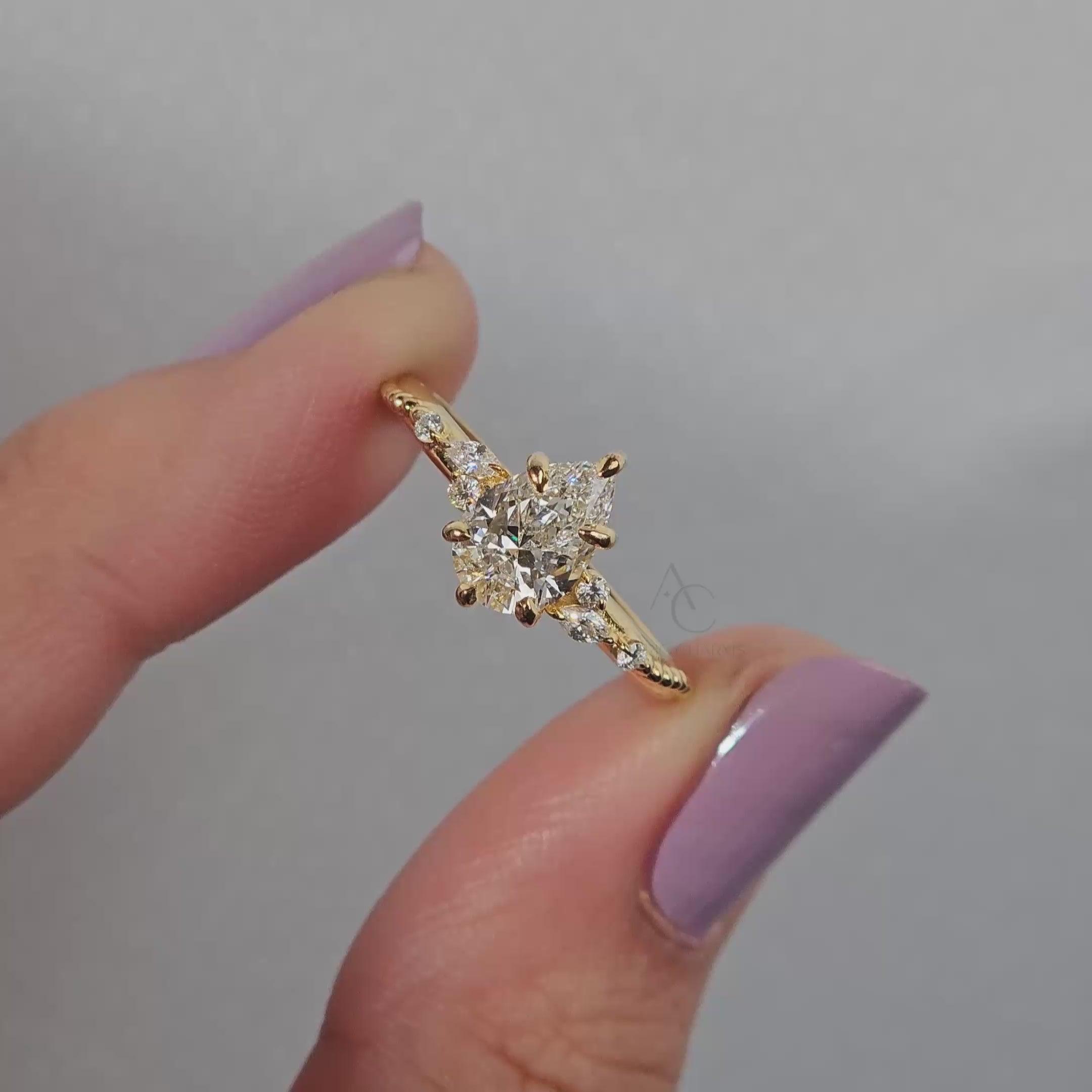 360 view of a floral diamond ring emphasizing fine metalwork and a sparkling center stone.