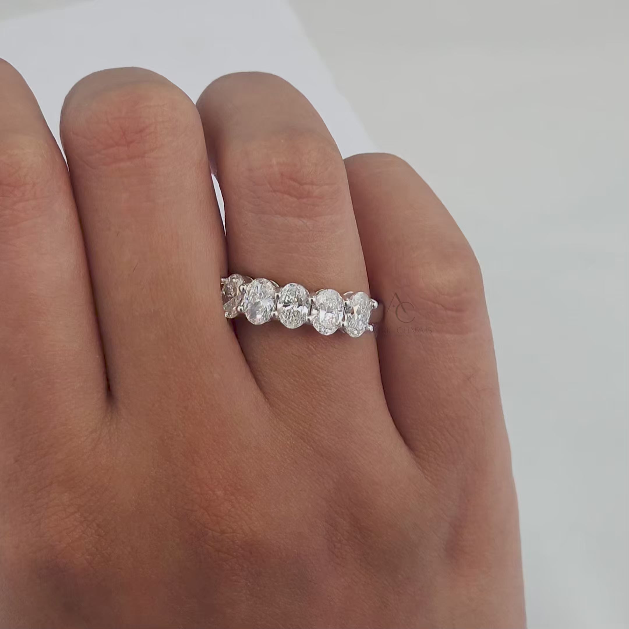 360-degree video showcasing a five-stone oval lab-grown diamond band with white gold detailing.