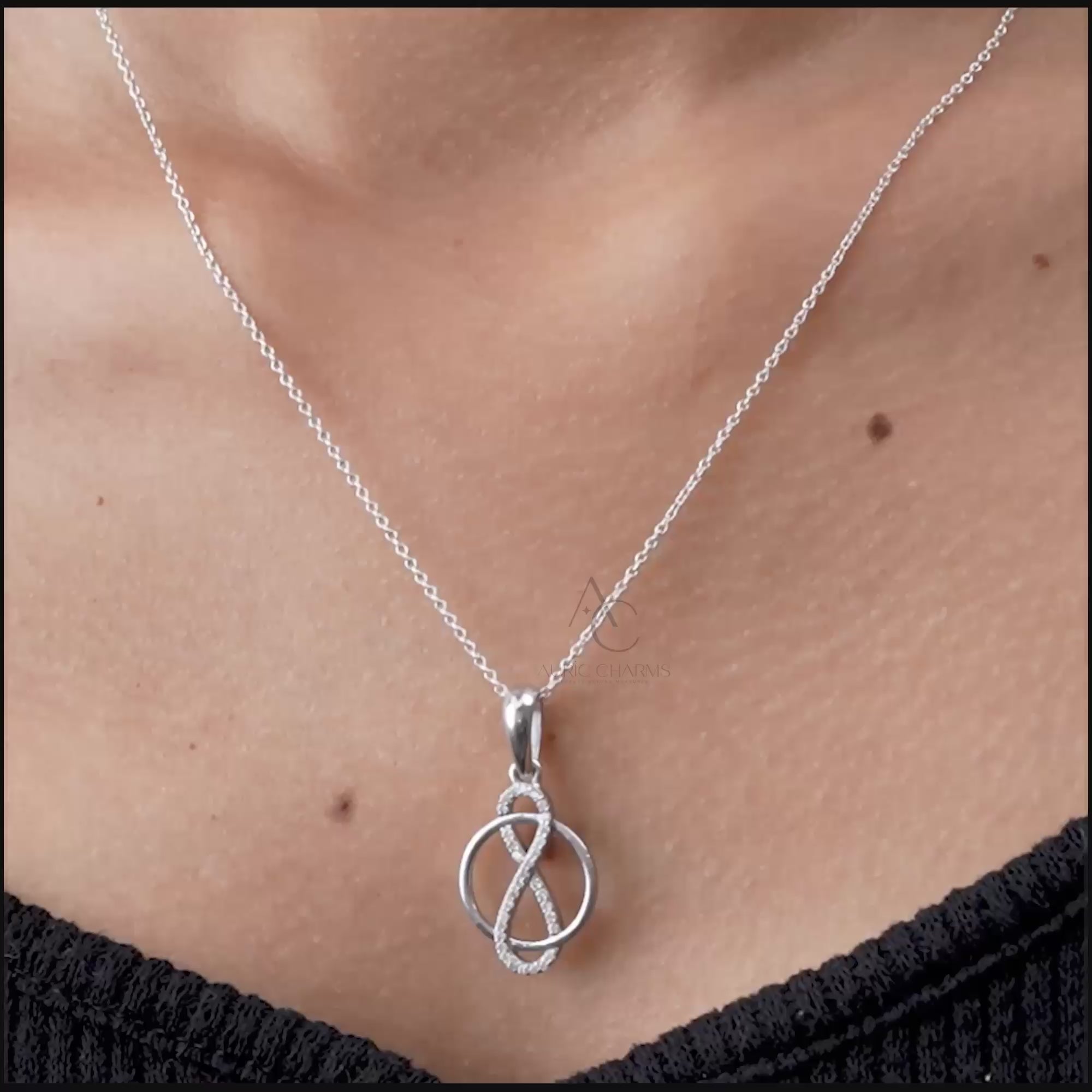 Elegant infinity circle pendant with lab-grown diamonds, worn on neck, symbolizing eternal love and luxury.