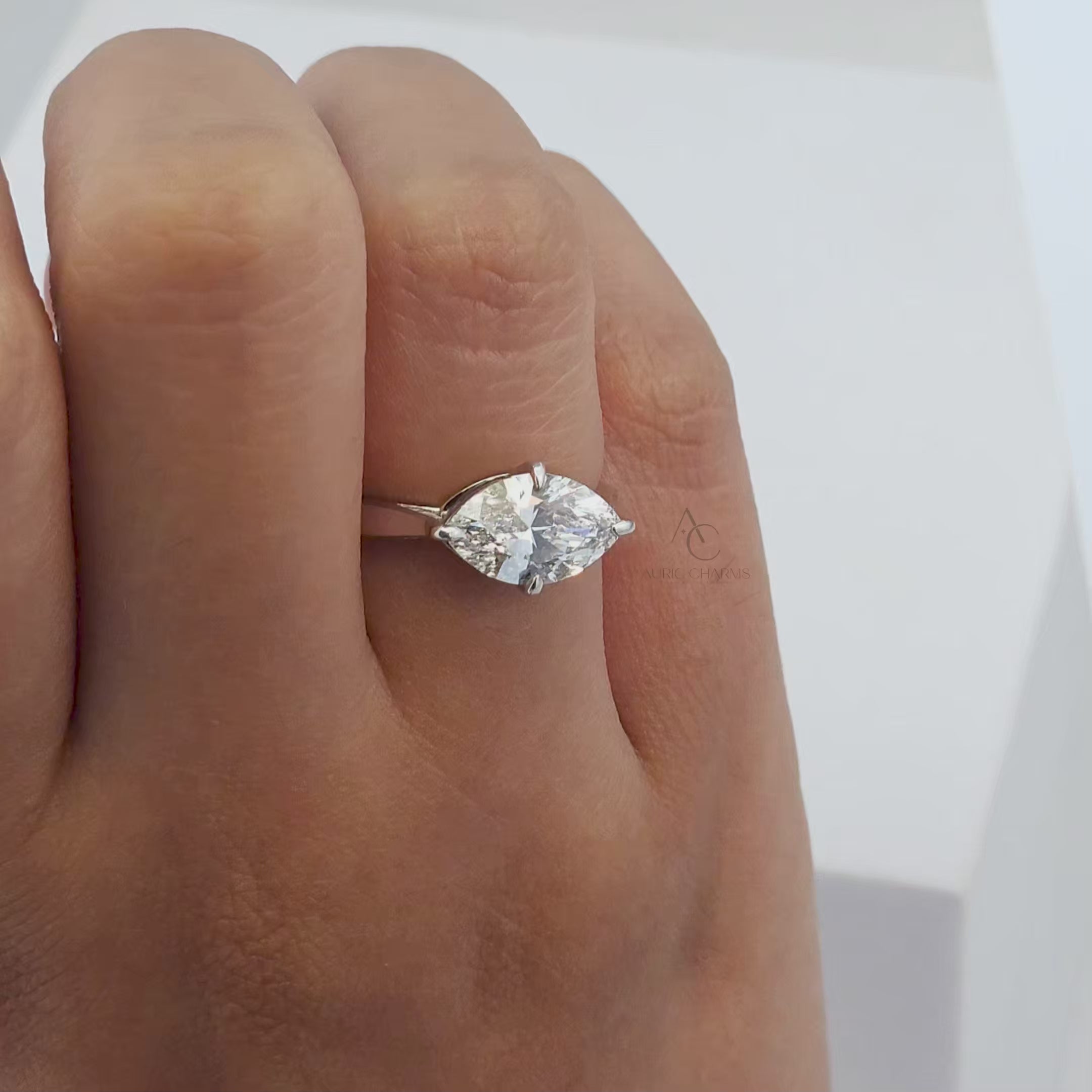 360-degree view of a marquise diamond engagement ring showcasing its elegance and brilliance from every angle.