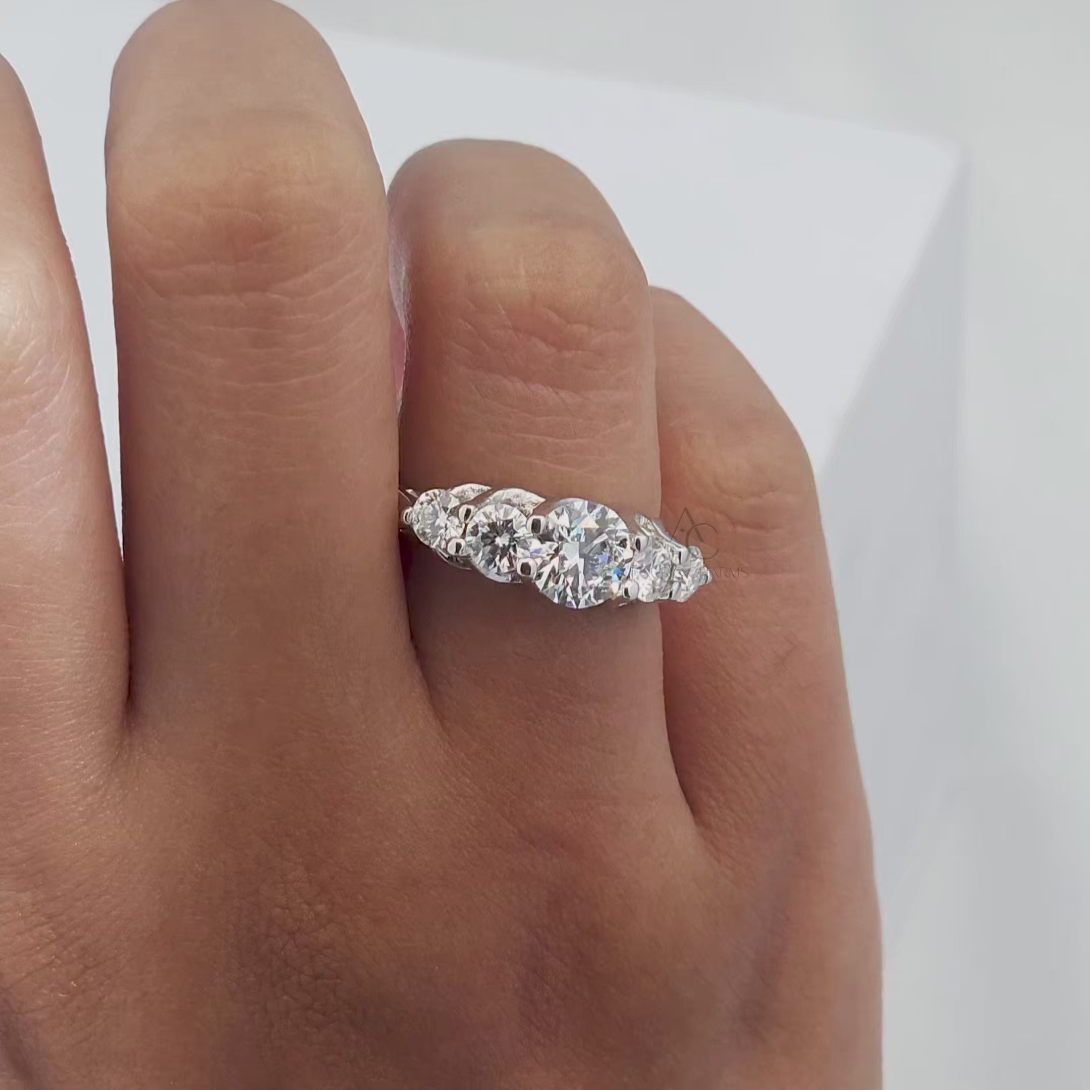 360-degree view of a stunning lab-grown diamond ring featuring three round diamonds in a timeless design.