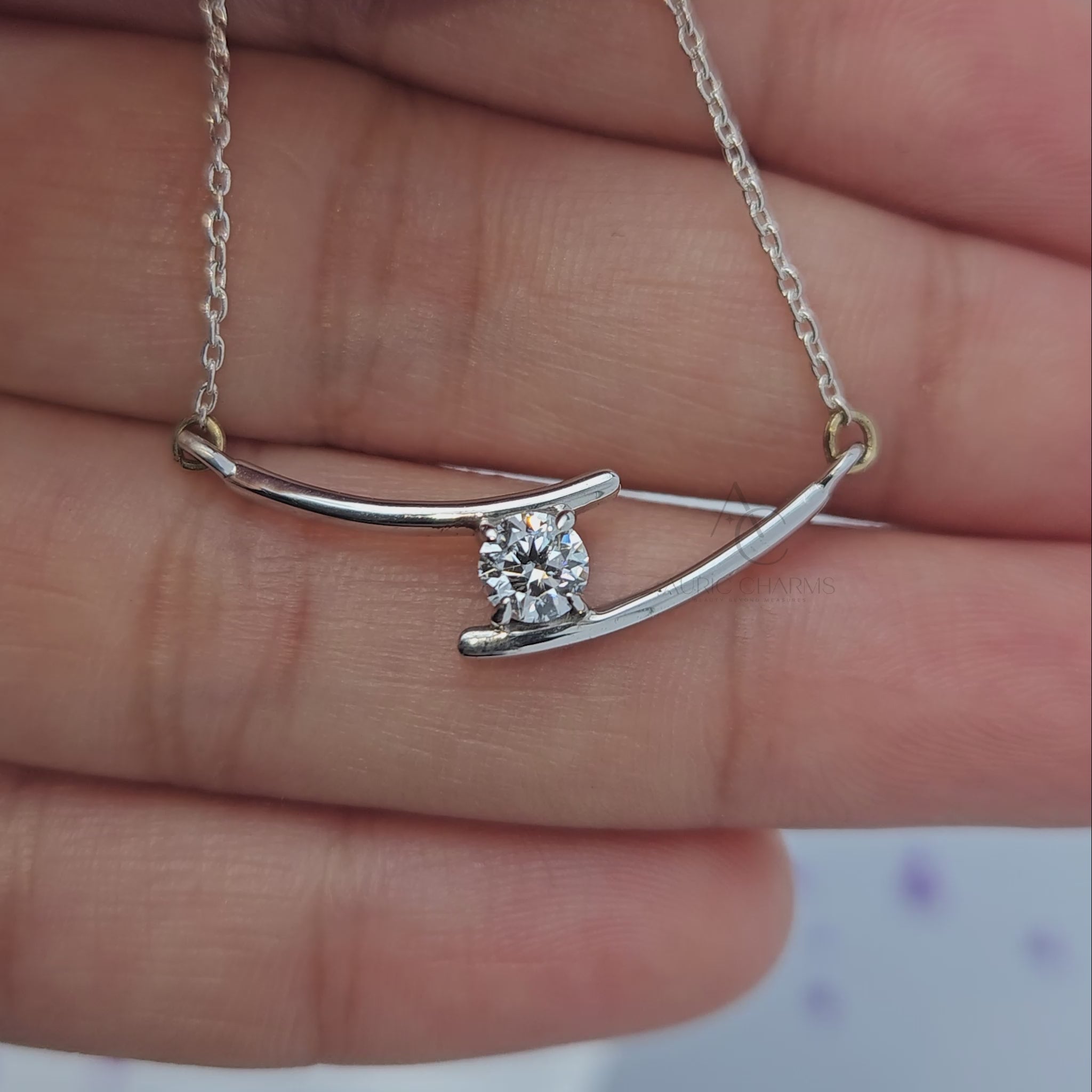360-degree view of curved white gold pendant necklace with lab-grown diamond.