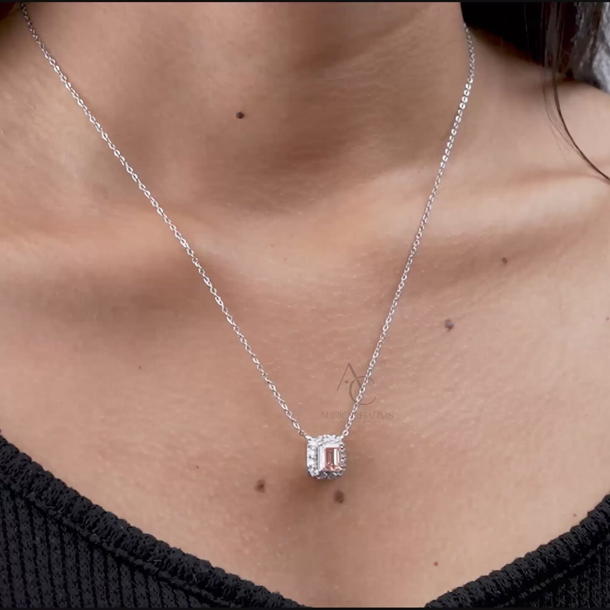 A stunning lab grown diamond halo pendant necklace worn on the neck, showcasing a fancy pink emerald cut for luxurious sparkle.
