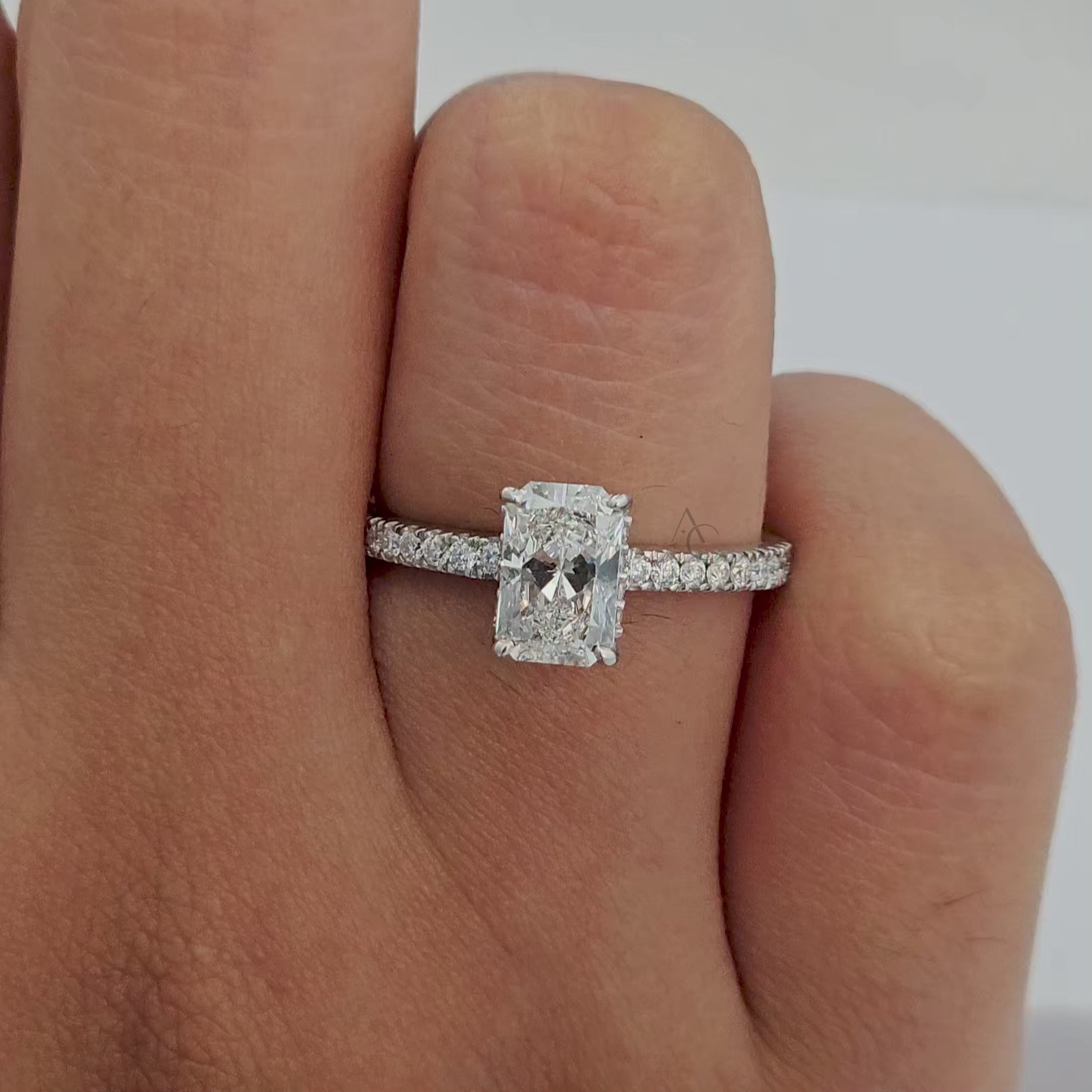 360-degree view of radiant diamond engagement ring with pavé detailing, showcasing brilliance.