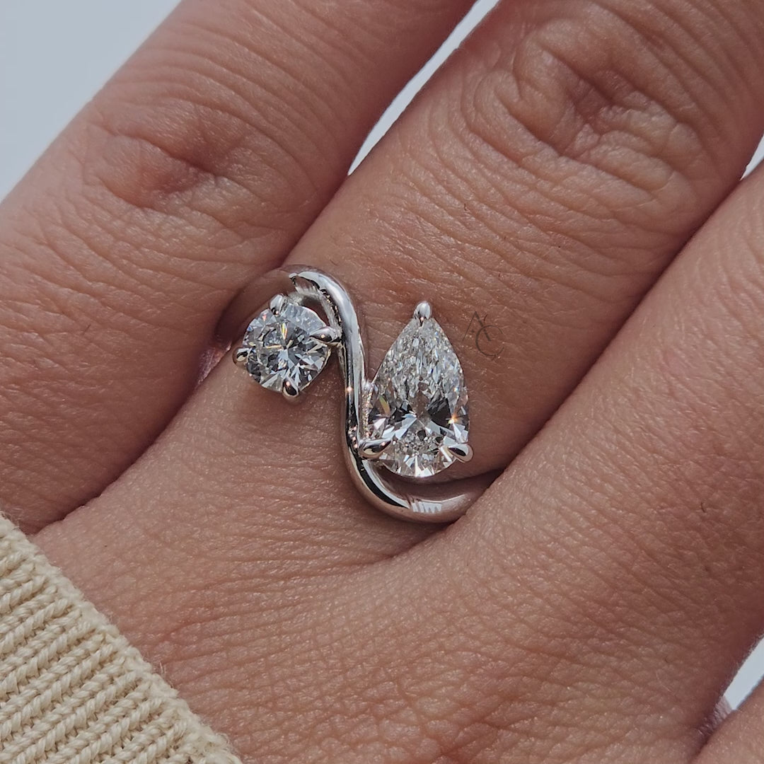 Close-up of diamond bypass ring showcasing design and sparkle.