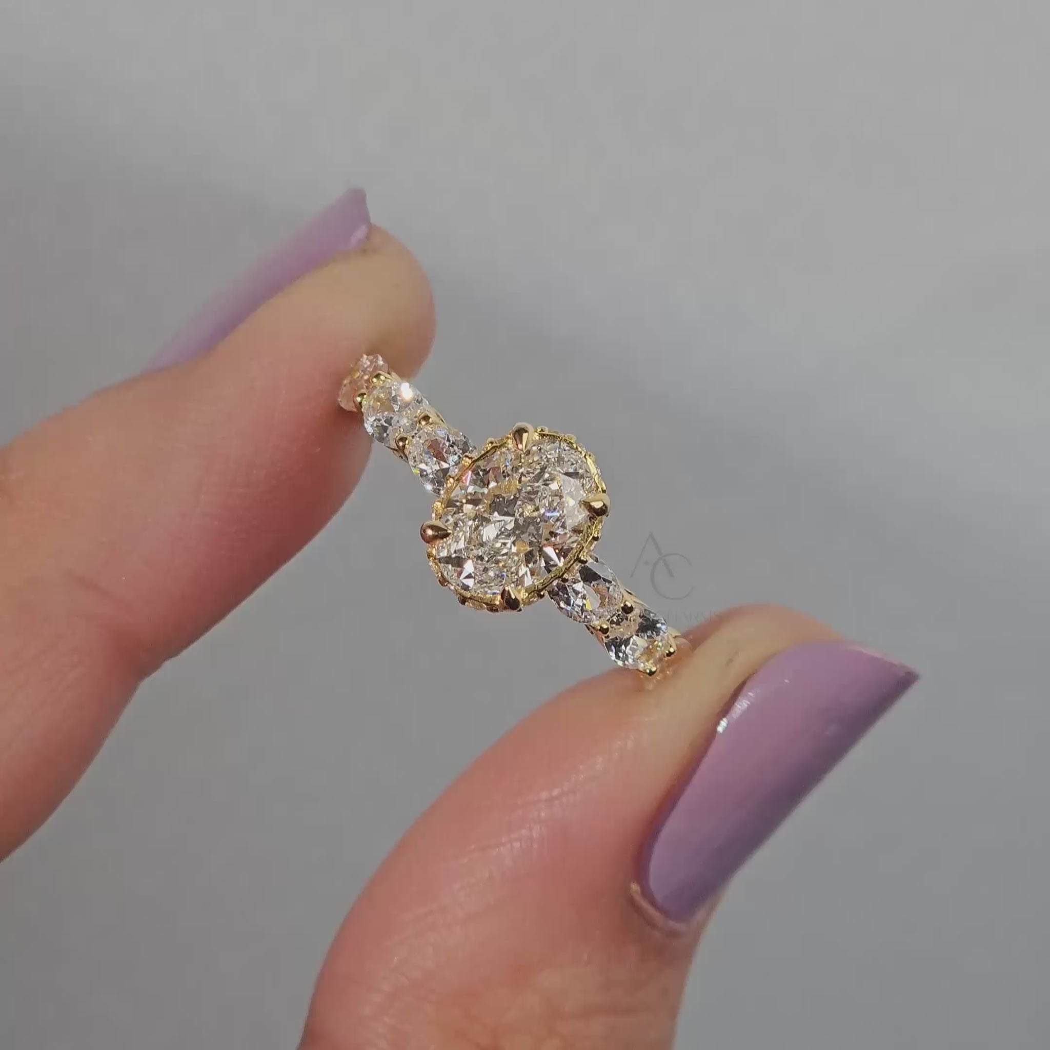 360 view of oval diamond ring with prong setting and gallery design.