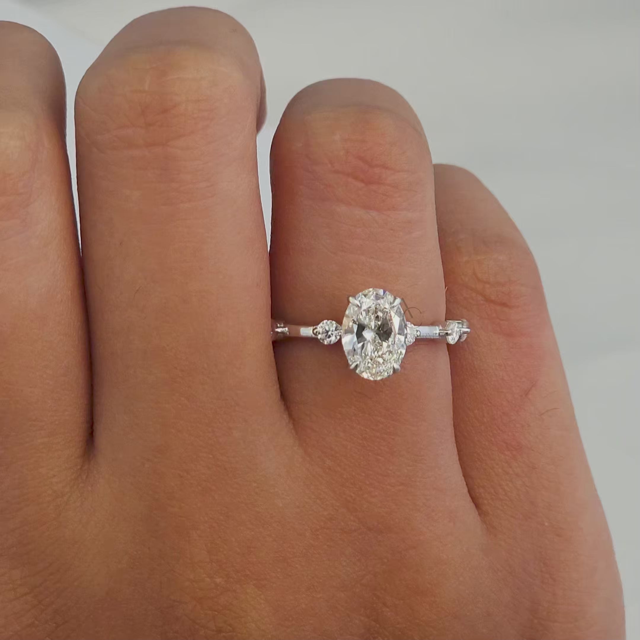 Video showcasing the radiant sparkle of an oval diamond engagement ring from multiple angles, emphasizing its premium craftsmanship and allure.