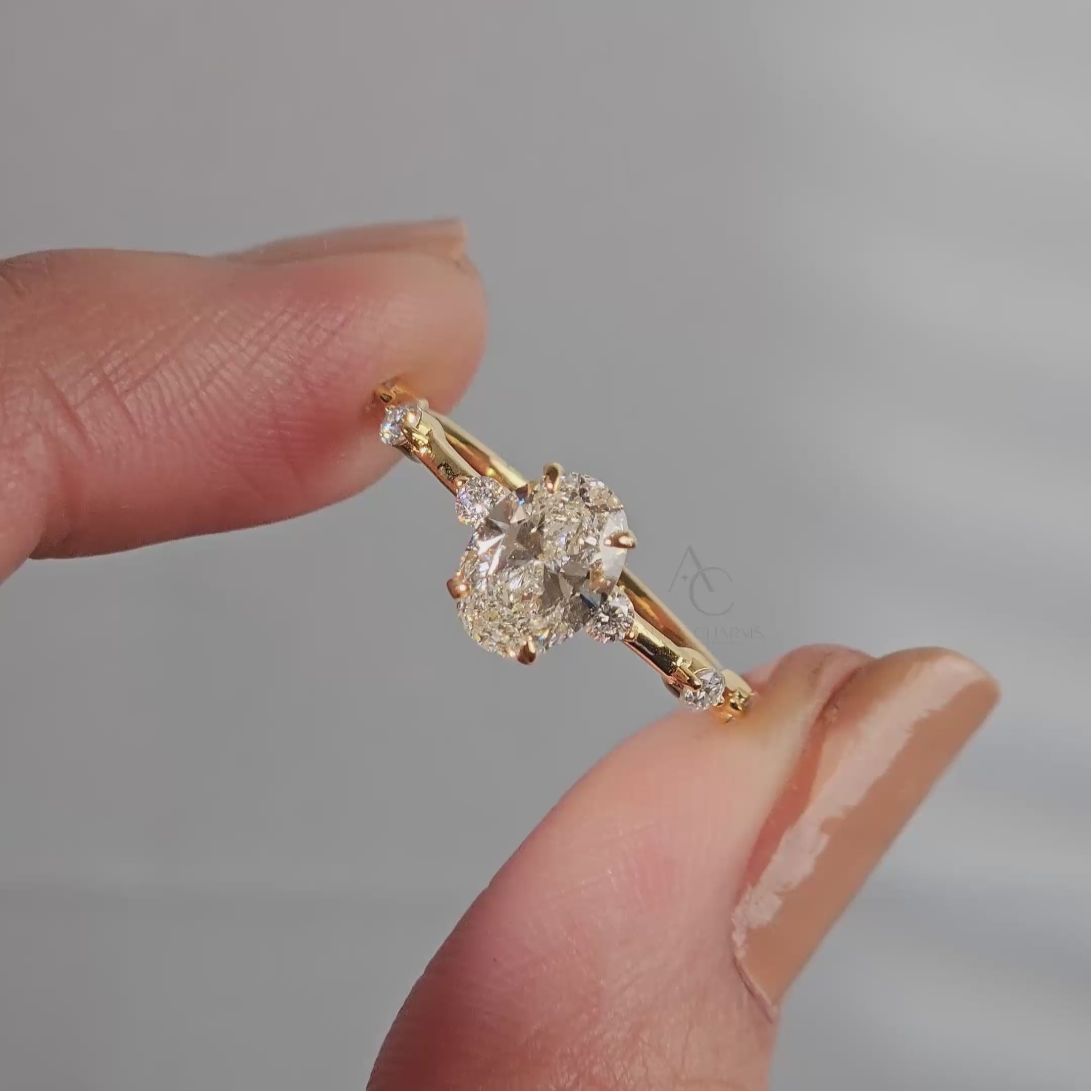 detail view of an oval-cut diamond ring highlighting its intricate band details.