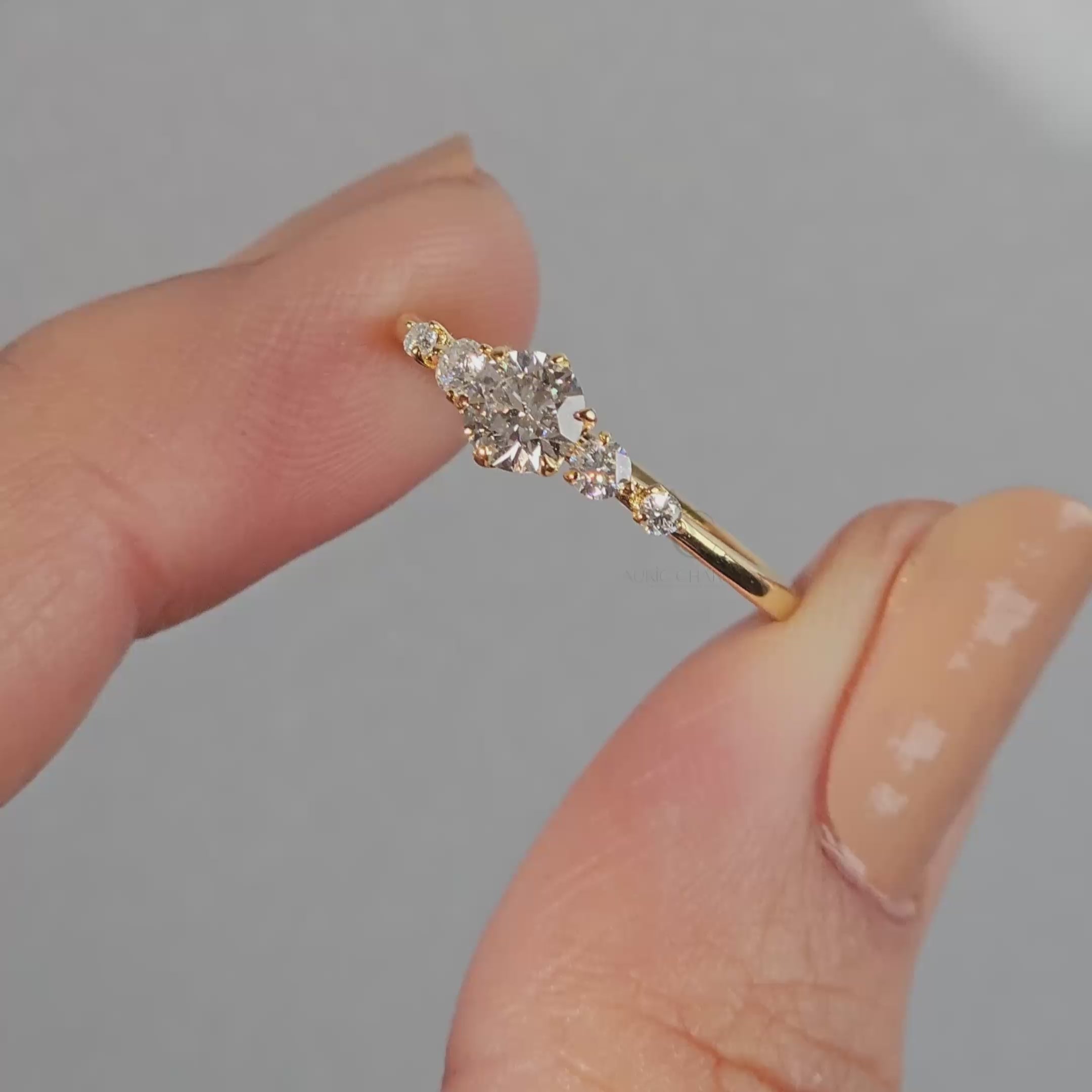 Round-cut diamond solitaire engagement ring on finger, emphasizing its dazzling brilliance.