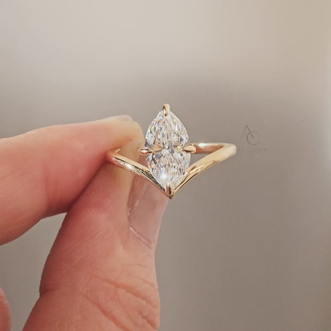 A luxurious Lyra marquise solitaire lab-grown diamond ring shown on hand, highlighting its elegant gold setting and refined design.