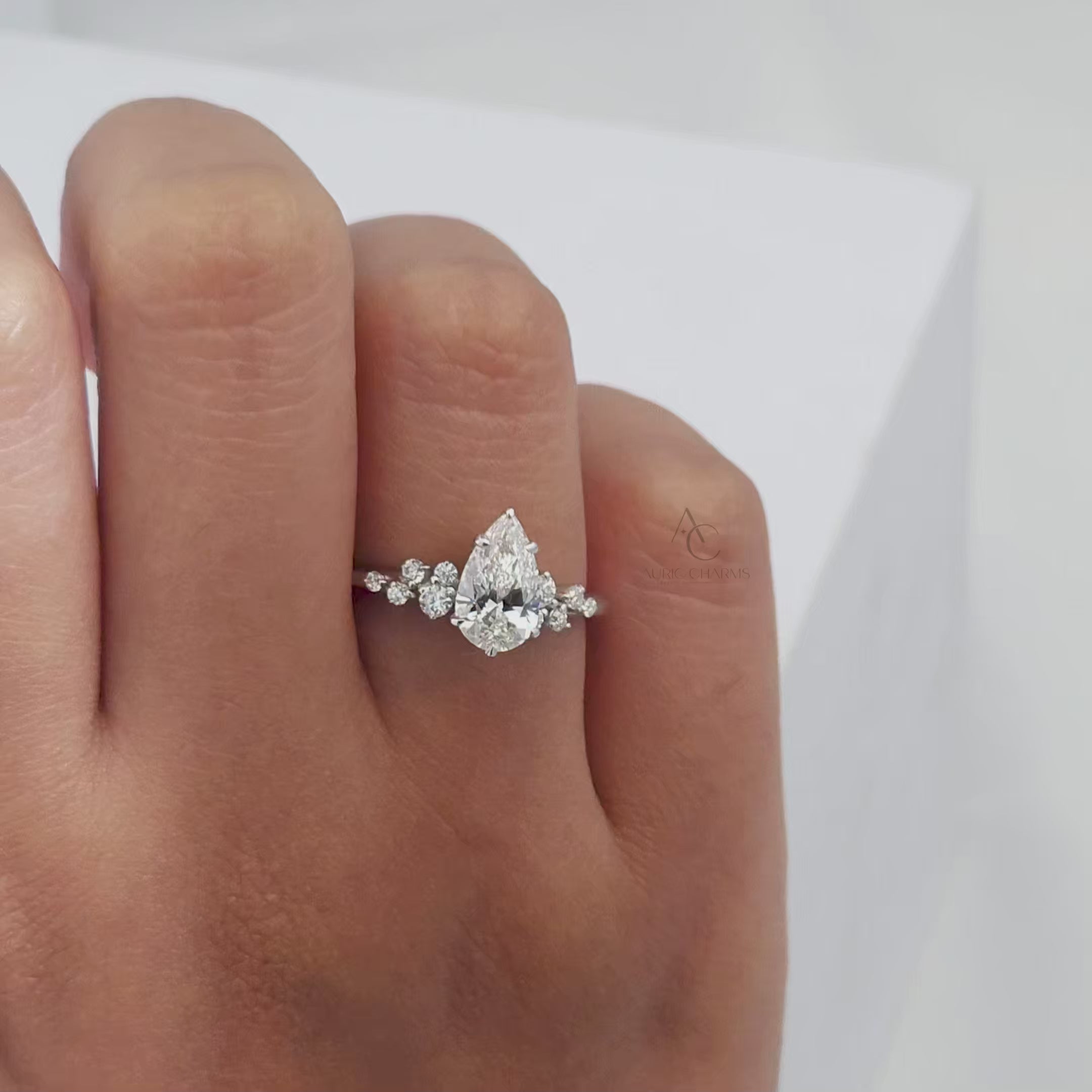 60-degree view of a pear-cut diamond ring showcasing its brilliance and intricate detailing.